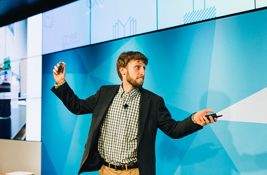 Joseph Charbonnet presenting on stage at Grad Slam 2018