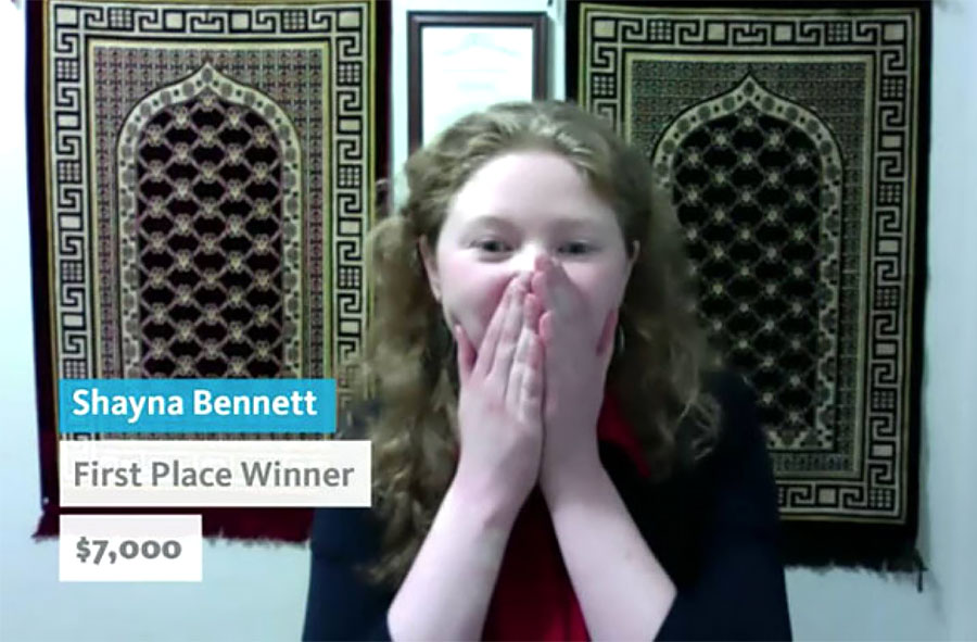 Shayla Bennett covers her mouth with both hands in surprise after being announced the winner of Grad Slam 2021